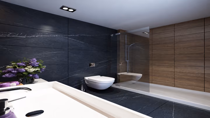 Interior rendering of a bathroom with a basin, countertop, wall-hung toilet and glass shower enclosure.