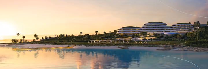 Architectural visualization of the shoreline and apartment development reflected in the sea at sunset.