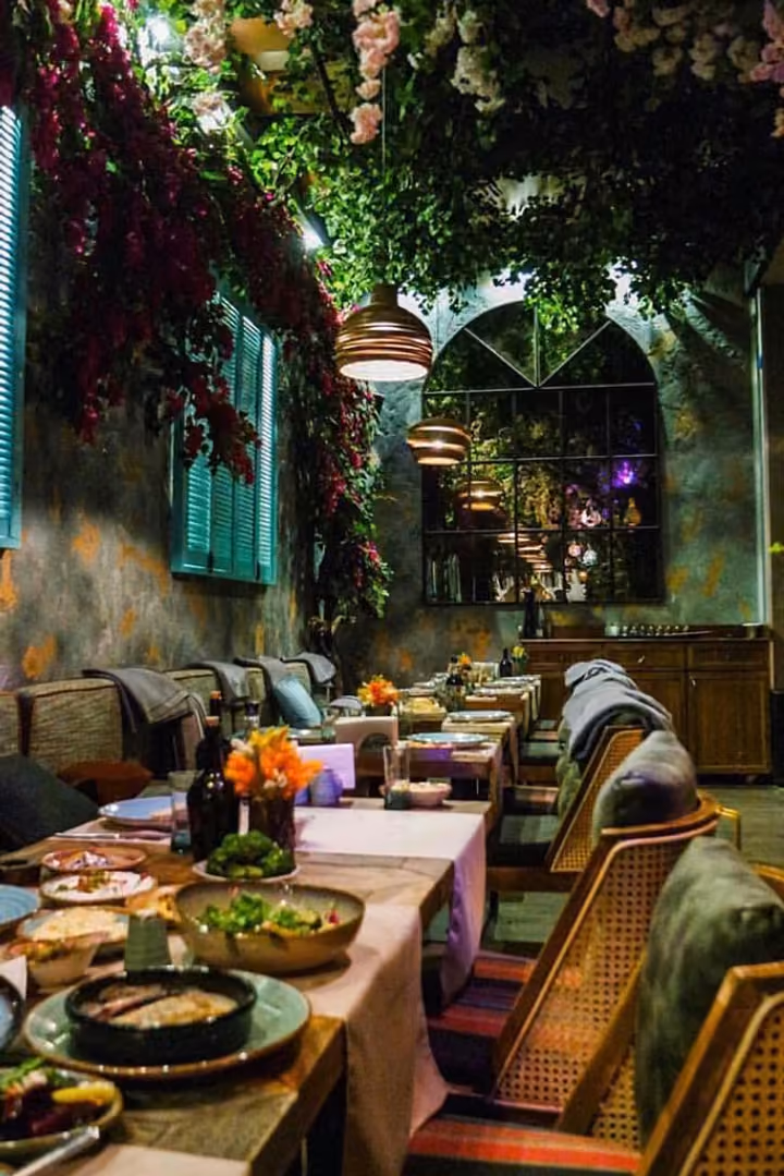 Cafe interior with decorative planting.