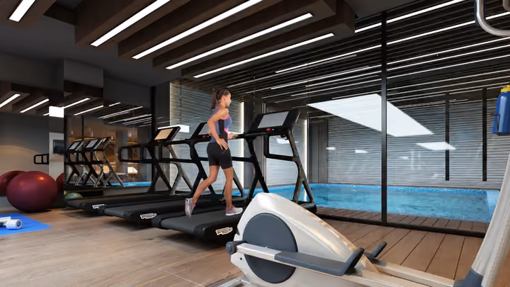 Interior rendering of fitness equipment beside glazing overlooking the indoor swimming pool.