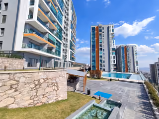Pool terrace and landscaped retaining wall.