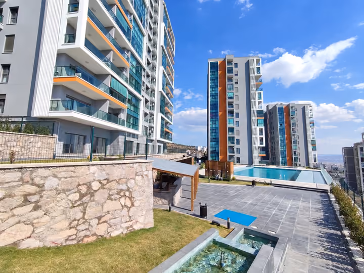 Pool terrace and landscaped retaining wall.