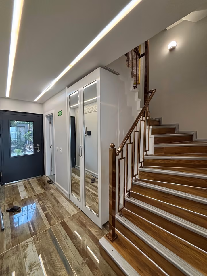 Entrance hall and internal staircase of the villa.
