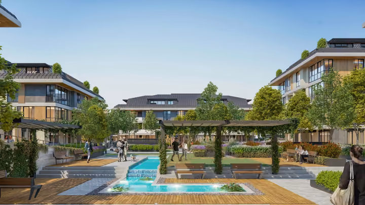 Architectural rendering illustrating a landscaped courtyard with water features, paths and low apartment blocks in Zekeriyakoy.