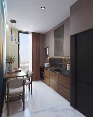 Kitchen with wood-toned cabinets, a refrigerator and a small dining table.