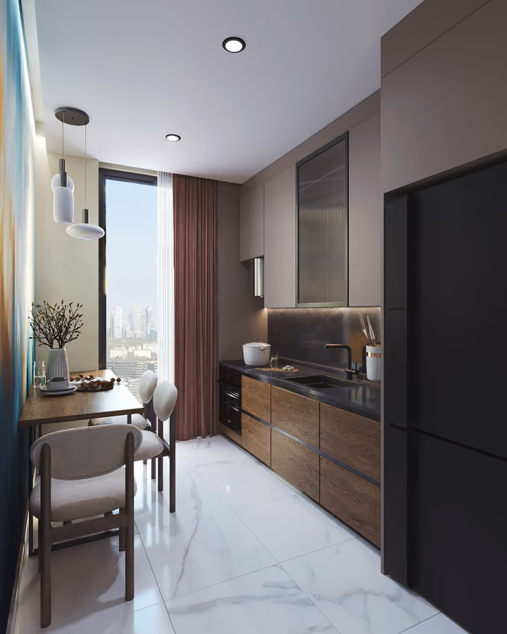 Kitchen with wood-toned cabinets, a refrigerator and a small dining table.
