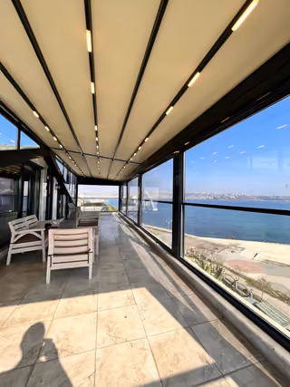Enclosed terrace panorama in the furnished seafront mansion in Buyukcekmece.