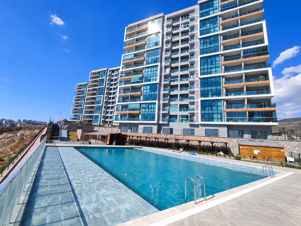 Residential buildings beside the outdoor pool.