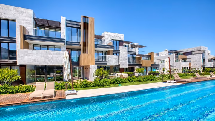 Balconies and poolside apartment facades in Boyalik, Cesme.