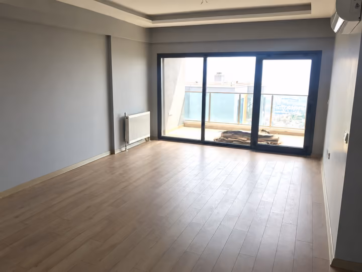 Living room with balcony access.
