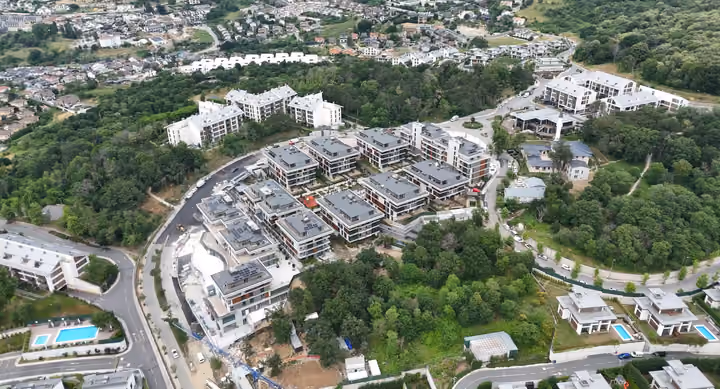 Aerial photograph showing the apartment complex, its surrounding woodland and neighbouring buildings in Zekeriyakoy.