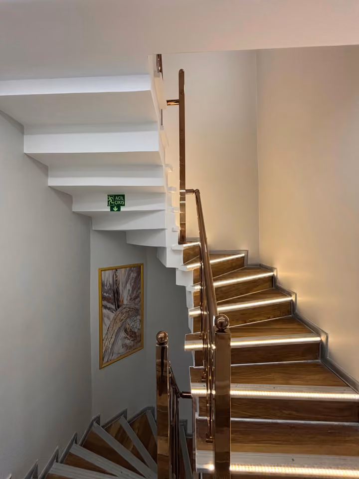 Internal staircase with illuminated steps.