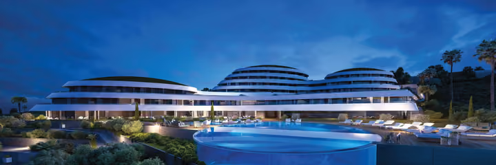 Architectural visualization of the buildings and swimming pool at night.