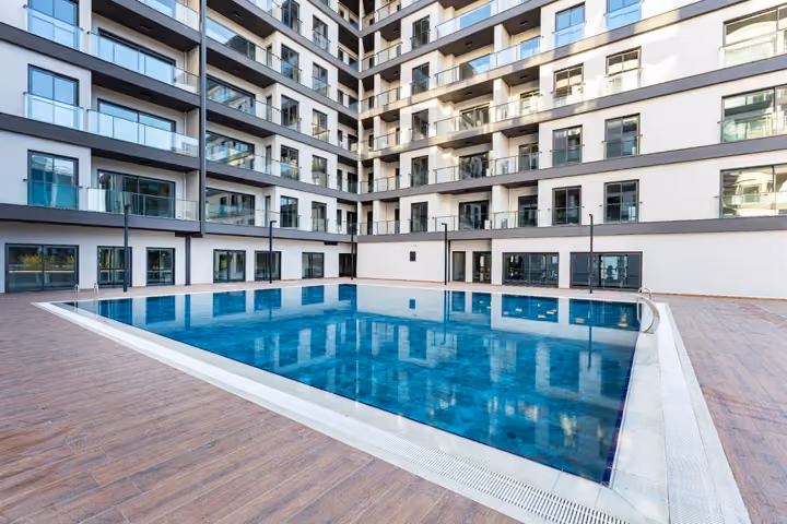 Photograph of courtyard pool and surrounding apartments.