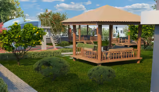Landscaped garden with a wooden gazebo, paved path and play equipment.