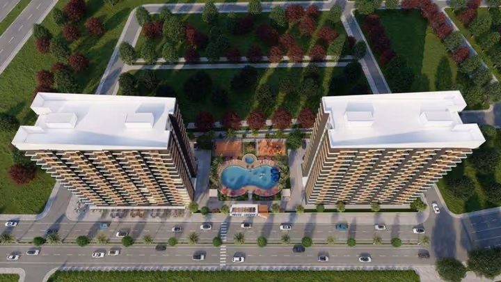 Aerial architectural visualization of two buildings and their shared landscaped courtyard.