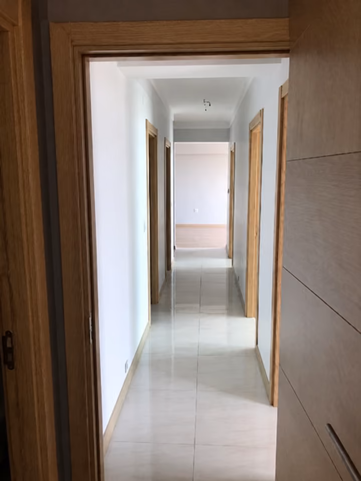 Hallway connecting the apartment rooms.