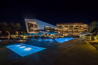 Outdoor pool and residences at night.