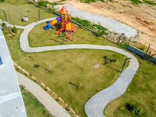 Children's playground surrounded by garden paths.